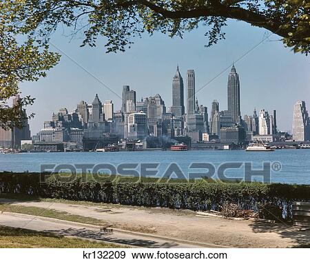 1950S Skyline Of Downtown Manhattan From Governors Island In The Harbor Nyc Usa View Large Photo Image Stock Photo - 1950S Skyline Of Downtown Manhattan From Governors Island In The Harbor Nyc Usa. Fotosearch