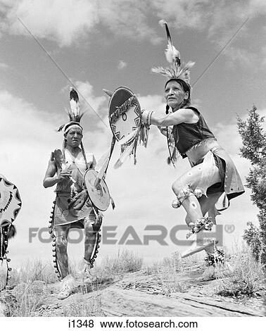 Stock Photo - 1950S Two Men Native American Taos Indians Performing Dance At Gallup Ceremonial. Fotosearch