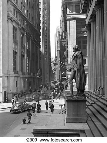 1950S Wall Street From Steps Of Federal Hall National Memorial Looking Towards Trinity Church In New York City Usa View Large Photo Image Stock Photo - 1950S Wall Street From Steps Of Federal Hall National Memorial Looking Towards Trinity Church In New York City Usa . Fotosearch