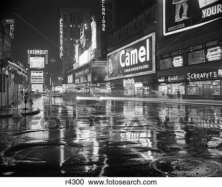 1950S Wet Rainy Streets Of Times Square At Night Neon Signs Advertising New York City Ny Usa View Large Photo Image Stock Image - 1950S Wet Rainy Streets Of Times Square At Night Neon Signs Advertising New York City Ny Usa. Fotosearch