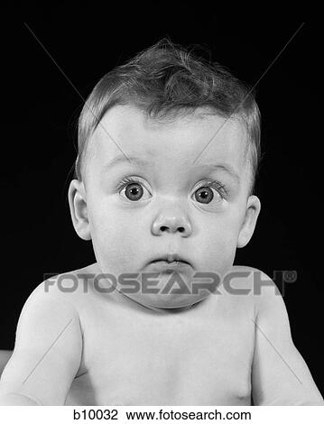 1950S Wide Eyed Chubby Cheek Baby Making Funny Facial Expression Looking At Camera View Large Photo Image Stock Image - 1950S Wide Eyed Chubby Cheek Baby Making Funny Facial Expression Looking At Camera. Fotosearch