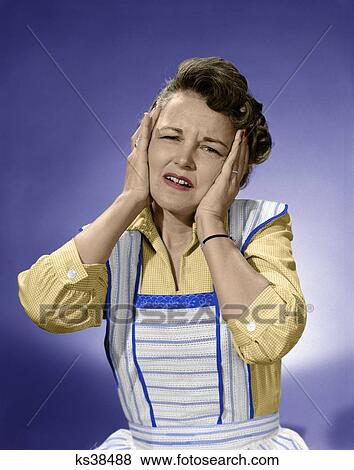 1950S Woman In Cotton Dress With Both Hands Over Her Ears Holding Her Head Frowning Looking At Camera View Large Photo Image Stock Photo - 1950S Woman In Cotton Dress With Both Hands Over Her Ears Holding Her Head Frowning Looking At Camera. Fotosearch