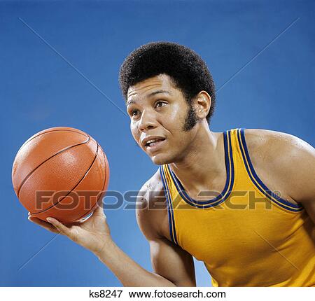 1960s 1970s AFRICAN AMERICAN MAN HOLDING BASKETBALL View Large Photo Image Stock Photo - 1960s 1970s AFRICAN AMERICAN MAN HOLDING BASKETBALL. Fotosearch