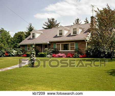 1960s 1970s ARCHITECTURE FIELDSTONE SUBURBAN HOUSE HOME WITH PICTURE WINDOW FLAGSTONE WALK GREEN GRASS LAWN AND TV ANTENNA View Large Photo Image Stock Photo - 1960s 1970s ARCHITECTURE FIELDSTONE SUBURBAN HOUSE HOME WITH PICTURE WINDOW FLAGSTONE WALK GREEN GRASS LAWN AND TV ANTENNA. Fotosearch