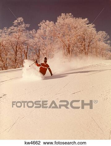 1960s 1970s MAN SKIER SHUSHING DOWN SLOPE KICKING UP SPRAY OF POWDER SNOW WEARING RED SWEATER View Large Photo Image Stock Image - 1960s 1970s MAN SKIER SHUSHING DOWN SLOPE KICKING UP SPRAY OF POWDER SNOW WEARING RED SWEATER. Fotosearch