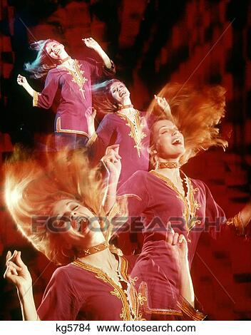 1960S 1970S Multiple Exposure Woman Wearing Purple Dashiki Wildly Dancing To Disco Dance Music View Large Photo Image Picture - 1960S 1970S Multiple Exposure Woman Wearing Purple Dashiki Wildly Dancing To Disco Dance Music. Fotosearch