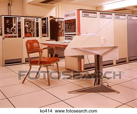 1960s 1970s OFFICE COMPUTER ROOM MAN TECHNICIAN CHANGING TAPE IN MAINFRAME TAPE STORAGE SYSTEM MACHINE View Large Photo Image Picture - 1960s 1970s OFFICE COMPUTER ROOM MAN TECHNICIAN CHANGING TAPE IN MAINFRAME TAPE STORAGE SYSTEM MACHINE. Fotosearch