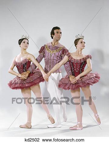 1960s 1970s PAS DE TROIS THREE BALLET DANCERS INTERLOCKED HANDS ARMS WEARING CLASSICAL COSTUMES View Large Photo Image Stock Image - 1960s 1970s PAS DE TROIS THREE BALLET DANCERS INTERLOCKED HANDS ARMS WEARING CLASSICAL COSTUMES. Fotosearch