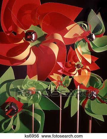 Stock Photograph - 1960s 1970s PINWHEELS PINWHEEL RED GREEN YELLOW MULTIPLE EXPOSURE PIN WHEEL PATTERNS PATTERN WIND TOY TOYS. Fotosearch