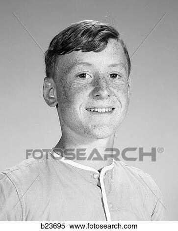 1960s 1970s PORTRAIT SMILING FRECKLE FACE TEEN BOY LOOKING AT CAMERA View Large Photo Image Stock Photography - 1960s 1970s PORTRAIT SMILING FRECKLE FACE TEEN BOY LOOKING AT CAMERA. Fotosearch