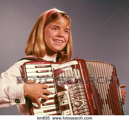1960s 1970s SMILING BLOND TEENAGE GIRL MUSICIAN PERFORMER PLAYING ACCORDION MUSICAL INSTRUMENT View Large Photo Image Stock Photography - 1960s 1970s SMILING BLOND TEENAGE GIRL MUSICIAN PERFORMER PLAYING ACCORDION MUSICAL INSTRUMENT. Fotosearch