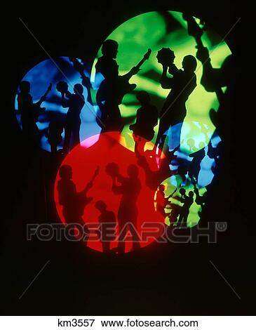 Stock Photo - 1960S 1970S Special Effect Silhouetted Psychedelic Montage Musicians In Green Red Blue Spotlights Playing And Dancing. Fotosearch