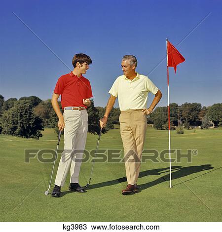 1960s 1970s TEENAGE BOY AND MIDDLEAGED FATHER ON GOLF COURSE GREEN LEANING ON CLUBS TALKING View Large Photo Image Stock Image - 1960s 1970s TEENAGE BOY AND MIDDLEAGED FATHER ON GOLF COURSE GREEN LEANING ON CLUBS TALKING. Fotosearch