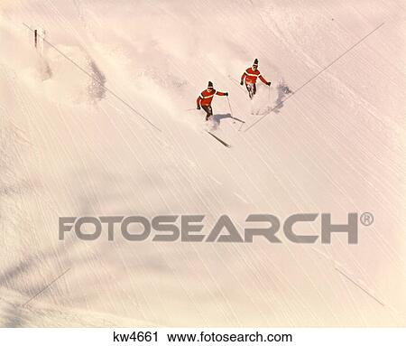 1960s 1970s TWO MEN BLACK CAPS RED SWEATERS SKIING DOWNHILL SLOPE SNOW SKIERS WINTER SPORTS View Large Photo Image Stock Image - 1960s 1970s TWO MEN BLACK CAPS RED SWEATERS SKIING DOWNHILL SLOPE SNOW SKIERS WINTER SPORTS. Fotosearch