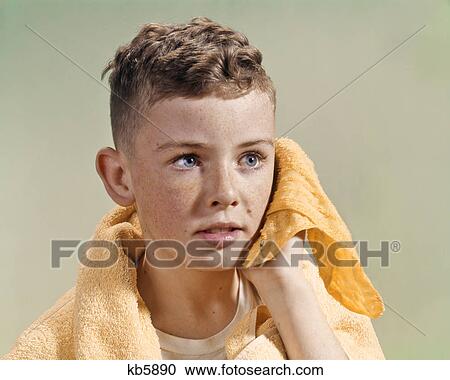 1960s ADOLESCENT YOUTHFUL BOY WITH BLUE EYES CURLY HAIR AND FRECKLES WASHING FACE WITH WASH CLOTH AND TOWEL View Large Photo Image Stock Image - 1960s ADOLESCENT YOUTHFUL BOY WITH BLUE EYES CURLY HAIR AND FRECKLES WASHING FACE WITH WASH CLOTH AND TOWEL. Fotosearch