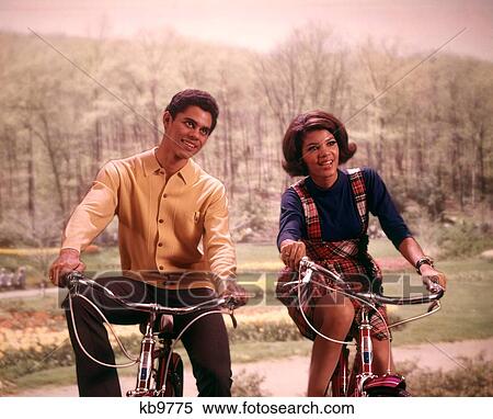 1960S African American Teenage Boy And Girl Riding Bicycles View Large Photo Image Stock Photography - 1960S African American Teenage Boy And Girl Riding Bicycles. Fotosearch