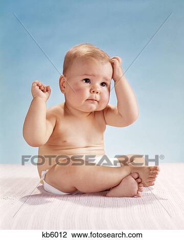 1960s BABY HAND ON HEAD SCRATCHING LOOKING PUZZLED View Large Photo Image Stock Image - 1960s BABY HAND ON HEAD SCRATCHING LOOKING PUZZLED. Fotosearch