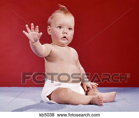 1960s BABY WEARING CLOTH DIAPER HOLDING HAND UP IN HALT STOP GESTURE WAVING GOODBYE View Large Photo Image Stock Photo - 1960s BABY WEARING CLOTH DIAPER HOLDING HAND UP IN HALT STOP GESTURE WAVING GOODBYE. Fotosearch
