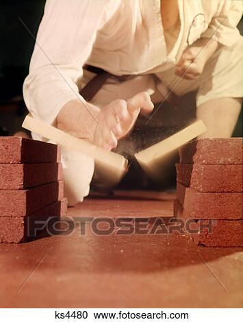 1960s BLUR MOTION HANDS OF KUNG FU MARTIAL ARTS PERFORMER BREAKING A BOARD View Large Photo Image Stock Image - 1960s BLUR MOTION HANDS OF KUNG FU MARTIAL ARTS PERFORMER BREAKING A BOARD. Fotosearch