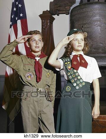 1960s BOY GIRL SCOUT IN UNIFORM SALUTING STANDING BY LIBERTY BELL IN INDEPENDENCE HALL PHILADELPHIA PA USA View Large Photo Image Stock Photo - 1960s BOY GIRL SCOUT IN UNIFORM SALUTING STANDING BY LIBERTY BELL IN INDEPENDENCE HALL PHILADELPHIA PA USA. Fotosearch