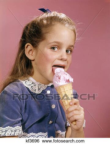 1960s BRUNETTE GIRL BLUE DRESS LICKING STRAWBERRY ICE CREAM CONE LOOKING AT CAMERA View Large Photo Image Stock Photograph - 1960s BRUNETTE GIRL BLUE DRESS LICKING STRAWBERRY ICE CREAM CONE LOOKING AT CAMERA. Fotosearch