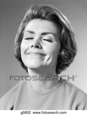 1960s BRUNETTE WOMAN EYES CLOSED SMILING DIMPLES HAPPY RELAXED SATISFIED CONTENT WISHING FACIAL EXPRESSION View Large Photo Image Stock Image - 1960s BRUNETTE WOMAN EYES CLOSED SMILING DIMPLES HAPPY RELAXED SATISFIED CONTENT WISHING FACIAL EXPRESSION. Fotosearch