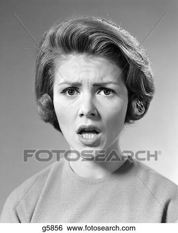 1960s BRUNETTE WOMAN WITH SHOCKED ANGRY SERIOUS FACIAL EXPRESSION LOOKING AT CAMERA View Large Photo Image Stock Photograph - 1960s BRUNETTE WOMAN WITH SHOCKED ANGRY SERIOUS FACIAL EXPRESSION LOOKING AT CAMERA. Fotosearch