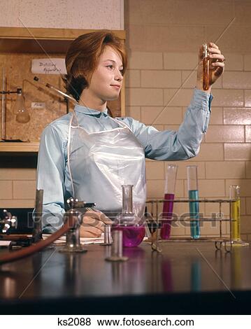 1960s COED FEMALE STUDENT CHEMISTRY LAB LABORATORY LOOKING AT TEST TUBE SCIENCE EDUCATION View Large Photo Image Stock Photo - 1960s COED FEMALE STUDENT CHEMISTRY LAB LABORATORY LOOKING AT TEST TUBE SCIENCE EDUCATION. Fotosearch
