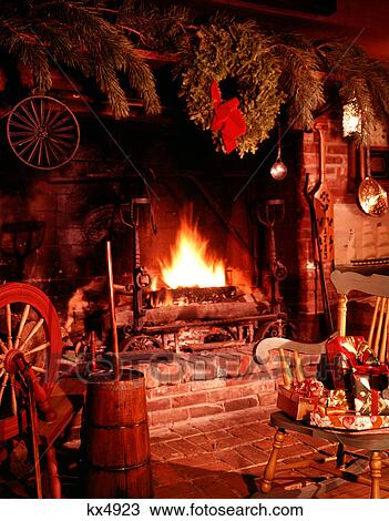 1960s COLONIAL STYLE FIREPLACE FIRE BLAZING DECORATED CHRISTMAS WREATH CHAIR WITH PRESENTS AND GIFTS View Large Photo Image Stock Image - 1960s COLONIAL STYLE FIREPLACE FIRE BLAZING DECORATED CHRISTMAS WREATH CHAIR WITH PRESENTS AND GIFTS. Fotosearch