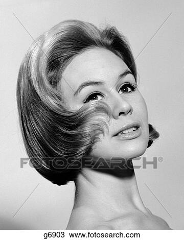1960S Fashion Portrait Of Woman With Hair Curling Up On Her Cheek View Large Photo Image Stock Image - 1960S Fashion Portrait Of Woman With Hair Curling Up On Her Cheek. Fotosearch