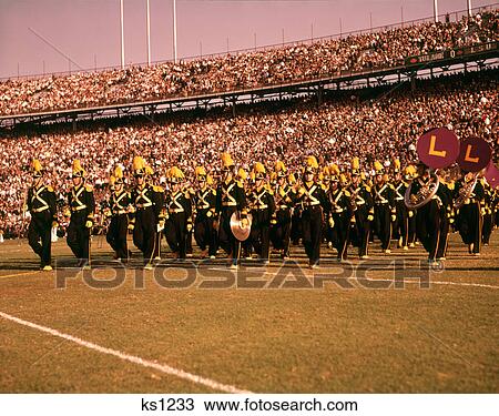 1960s LOUISIANA STATE UNIVERSITY MARCHING BAND PERFORMING AT FOOTBALL GAME HALF TIME LSU TULANE STADIUM NEW ORLEANS LA USA View Large Photo Image Stock Image - 1960s LOUISIANA STATE UNIVERSITY MARCHING BAND PERFORMING AT FOOTBALL GAME HALF TIME LSU TULANE STADIUM NEW ORLEANS LA USA. Fotosearch