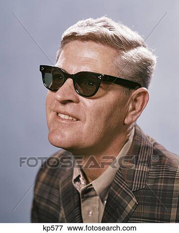 1960s MIDDLE AGED MAN WEARING SUNGLASSES SMILING View Large Photo Image Stock Photo - 1960s MIDDLE AGED MAN WEARING SUNGLASSES SMILING. Fotosearch