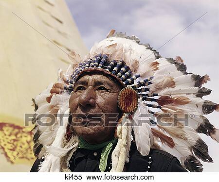 1960s NATIVE AMERICAN INDIAN MAN CHIEF GULL WEARING FEATHER BONNET MORLEY STONEY SIOUX FIRST NATIONS RESERVATION ALBERTA CANADA View Large Photo Image Stock Photography - 1960s NATIVE AMERICAN INDIAN MAN CHIEF GULL WEARING FEATHER BONNET MORLEY STONEY SIOUX FIRST NATIONS RESERVATION ALBERTA CANADA. Fotosearch