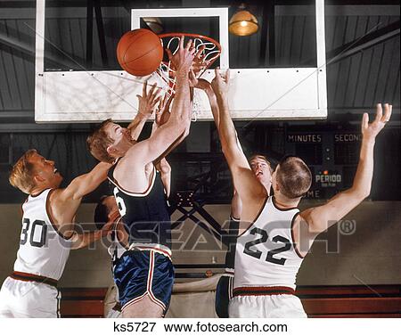 1960s PLAYERS UNDER BASKET REACHING FOR BALL BASKETBALL TEAM SPORTS View Large Photo Image Stock Photo - 1960s PLAYERS UNDER BASKET REACHING FOR BALL BASKETBALL TEAM SPORTS. Fotosearch