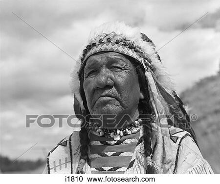 1960S Portrait Native American Man Chief Blackfoot Indian Tribe In Browning Montana View Large Photo Image Stock Image - 1960S Portrait Native American Man Chief Blackfoot Indian Tribe In Browning Montana . Fotosearch