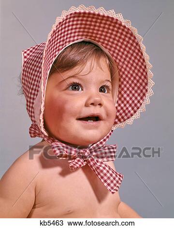 1960s PORTRAIT OF BABY GIRL WEARING RED CHECKED BONNET WITH BIG BRIM View Large Photo Image Stock Image - 1960s PORTRAIT OF BABY GIRL WEARING RED CHECKED BONNET WITH BIG BRIM. Fotosearch