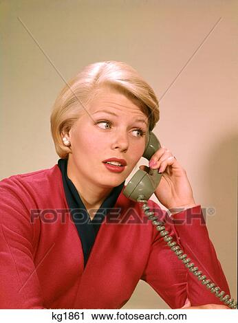 1960s PORTRAIT OF SERIOUS CONCERNED BLOND WOMAN TALKING ON TELEPHONE View Large Photo Image Stock Image - 1960s PORTRAIT OF SERIOUS CONCERNED BLOND WOMAN TALKING ON TELEPHONE. Fotosearch