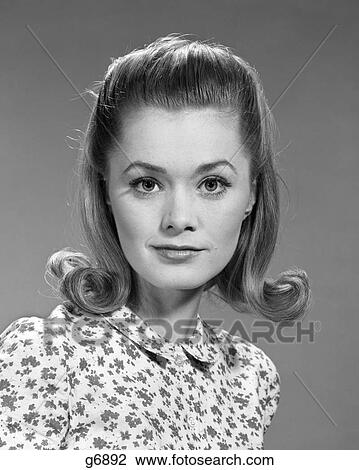 1960S Portrait Of Serious Young Woman With Flip Hair Style And Wearing  Print Blouse Looking At Camera Stock Image | g6892 | Fotosearch