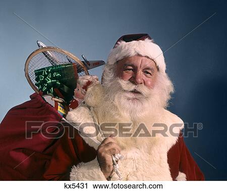 1960s PORTRAIT OF SMILING SANTA CLAUS LOOKING AT CAMERA BAG OF TOYS SHOULDER View Large Photo Image Stock Image - 1960s PORTRAIT OF SMILING SANTA CLAUS LOOKING AT CAMERA BAG OF TOYS SHOULDER. Fotosearch