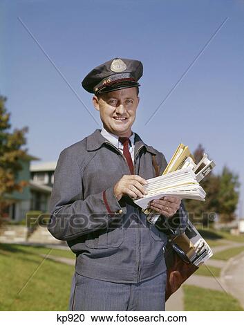 Stock Image - 1960s PORTRAIT OF SMILING SUBURBAN MAILMAN LOOKING AT CAMERA. Fotosearch