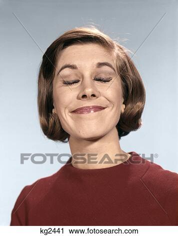 1960s PORTRAIT OF YOUNG WOMAN IN SWEATER WITH SMUG SMILE PLEASED AND HAPPY EXPRESSION View Large Photo Image Stock Image - 1960s PORTRAIT OF YOUNG WOMAN IN SWEATER WITH SMUG SMILE PLEASED AND HAPPY EXPRESSION. Fotosearch