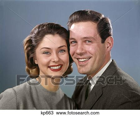 1960s PORTRAIT SMILING HAPPY COUPLE MAN WOMAN HUSBAND AND WIFE LOOKING AT CAMERA STRAIGHT AHEAD View Large Photo Image Stock Image - 1960s PORTRAIT SMILING HAPPY COUPLE MAN WOMAN HUSBAND AND WIFE LOOKING AT CAMERA STRAIGHT AHEAD. Fotosearch