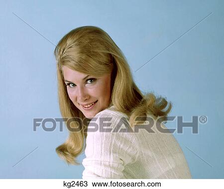 1960s PORTRAIT SMILING SEXY WOMAN WITH LONG BLOND HAIR WEARING WHITE SWEATER LOOKING AT CAMERA OVER SHOULDER View Large Photo Image Stock Image - 1960s PORTRAIT SMILING SEXY WOMAN WITH LONG BLOND HAIR WEARING WHITE SWEATER LOOKING AT CAMERA OVER SHOULDER. Fotosearch