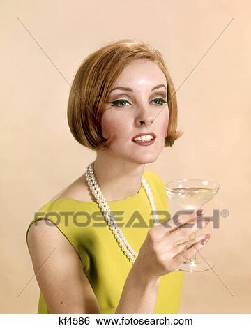 1960s PRETTY WOMAN RED HAIR LIME GREEN DRESS PEARL NECKLACE TOASTING WITH CHAMPAGNE GLASS View Large Photo Image Stock Photograph - 1960s PRETTY WOMAN RED HAIR LIME GREEN DRESS PEARL NECKLACE TOASTING WITH CHAMPAGNE GLASS. Fotosearch