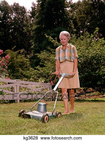 1960s SENIOR WOMAN PUSHING ELECTRIC LAWN MOWER CUTTING GRASS View Large Photo Image Stock Photo - 1960s SENIOR WOMAN PUSHING ELECTRIC LAWN MOWER CUTTING GRASS. Fotosearch