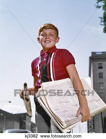 1960s SMILING NEWSBOY RED HAIR WEARING RED SHIRT SELLING NEWSPAPERS ON SIDEWALK LOOKING AT CAMERA View Large Photo Image Stock Image - 1960s SMILING NEWSBOY RED HAIR WEARING RED SHIRT SELLING NEWSPAPERS ON SIDEWALK LOOKING AT CAMERA. Fotosearch