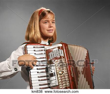 1960s TEEN GIRL PLAYING ACCORDION View Large Photo Image Stock Photo - 1960s TEEN GIRL PLAYING ACCORDION. Fotosearch
