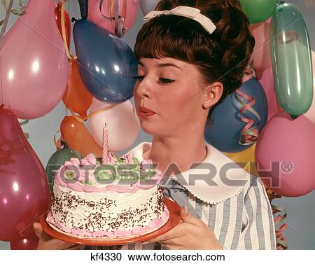 1960s TEENAGE GIRL BLOWING OUT THE CANDLE ON BIRTHDAY CAKE View Large Photo Image Stock Image - 1960s TEENAGE GIRL BLOWING OUT THE CANDLE ON BIRTHDAY CAKE. Fotosearch