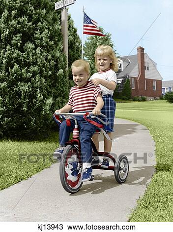 toddler riding tricycle