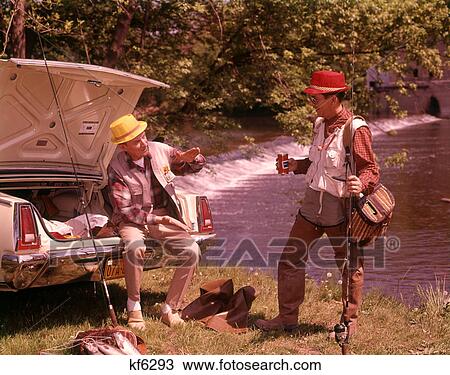 1960s TWO MEN WEARING FISHING GEAR DRINKING BEER TALKING BY OPEN CAR TRUNK ALONG STREAM View Large Photo Image Stock Image - 1960s TWO MEN WEARING FISHING GEAR DRINKING BEER TALKING BY OPEN CAR TRUNK ALONG STREAM. Fotosearch
